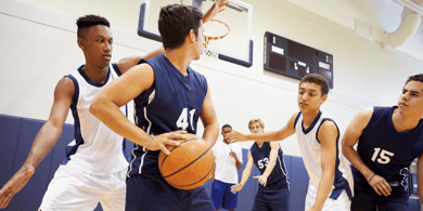 several boys playing basketball - High School Donation Fundraisers