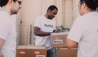 people working on loading boxes 