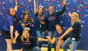 Image of Booster and Blue Mountain Elementary Staff Clebrating