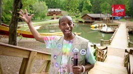 Chuck Friendly waving to the camera during his video.