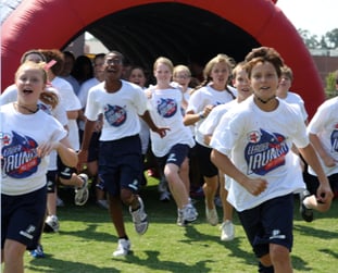 Students Running out of the tunnel during an event.