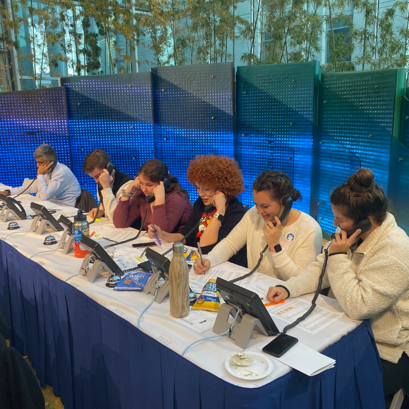Team Chicago works the a table of phones during the Mix Kids Thank-a-thon.
