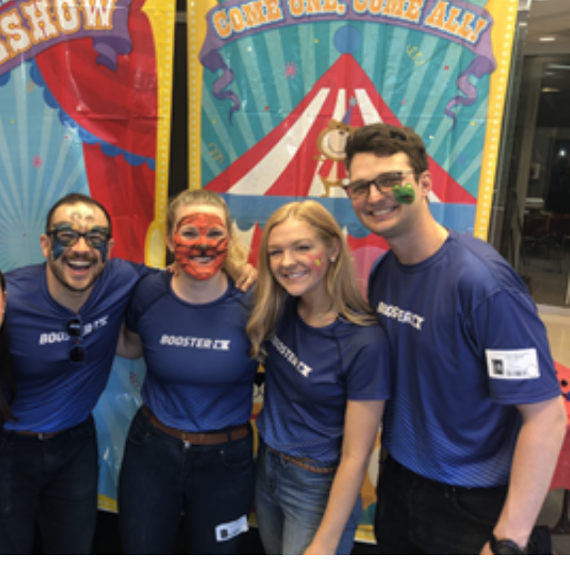 Boosterthon team Atlanta with painted faces at a children's healthcare event.