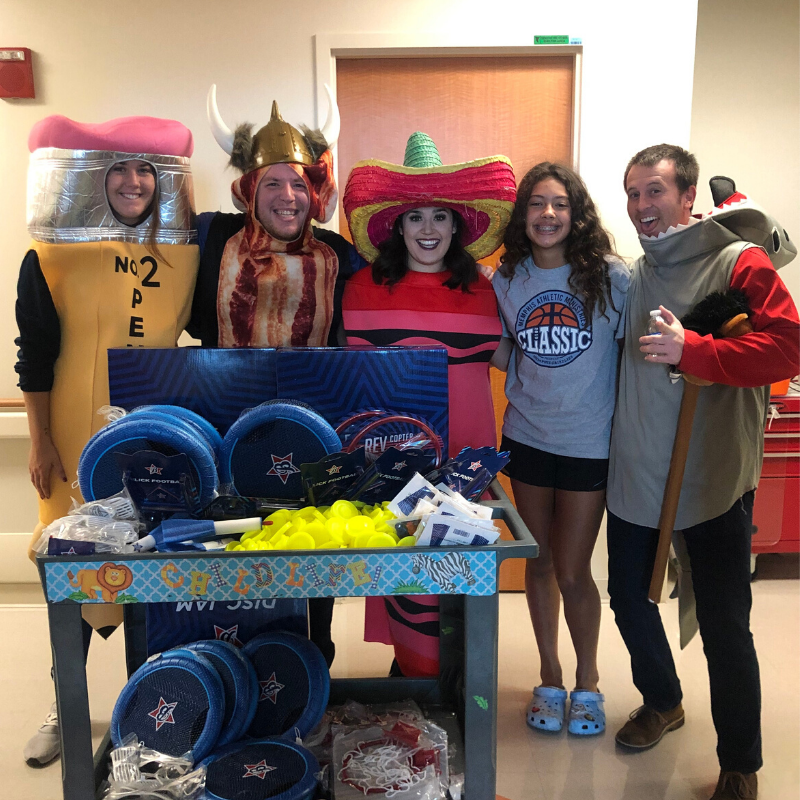 Team Big South, dressed in a variety of silly outfits like a pencil and a piece of bacon, smile for the camera.