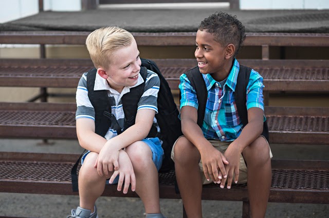 Two students talking at school