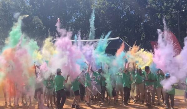 Students outside enjoying a color run