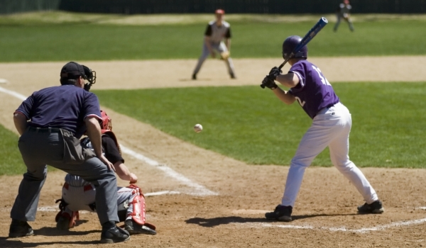 Image of a baseball batter up at bat getting ready to hit the ball