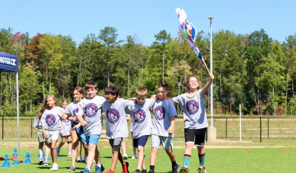 Image of student outside doing a fun run wearing school spirit shirts