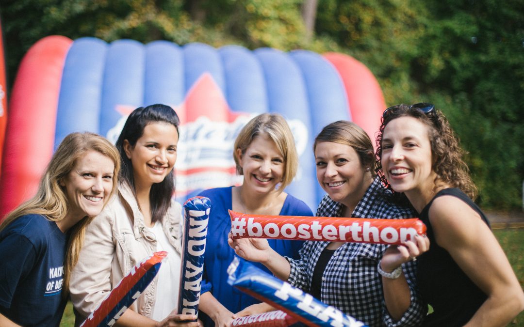 Group of mothers show off their Boosterthon cheering sticks